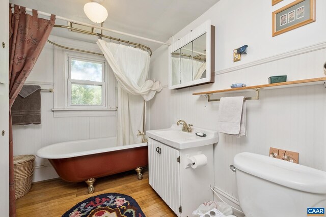 bathroom featuring hardwood / wood-style flooring, vanity, and toilet