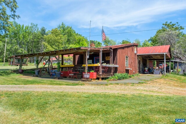 view of outdoor structure featuring a lawn