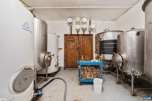 utility room featuring gas water heater