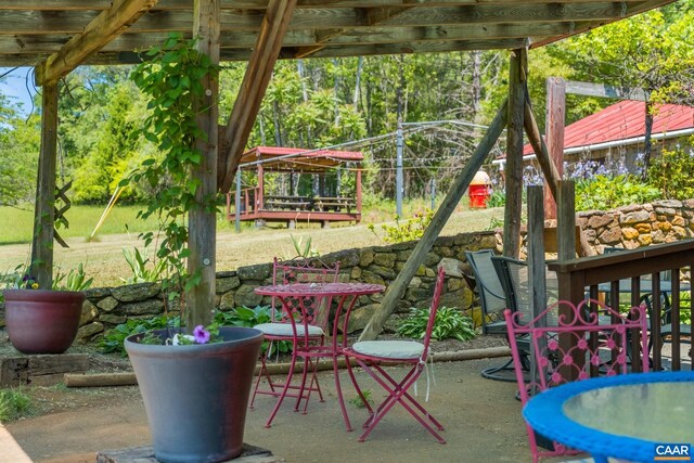 view of jungle gym featuring a patio