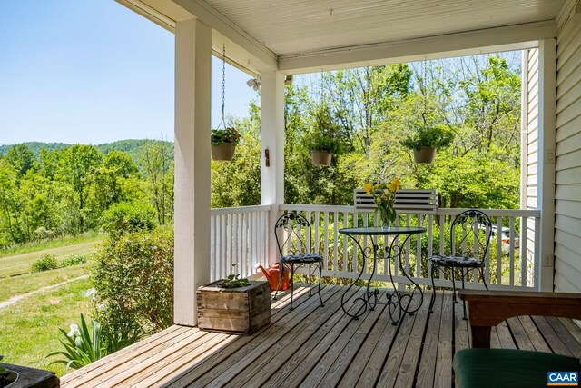 wooden deck featuring covered porch