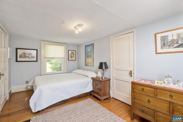 bedroom featuring light hardwood / wood-style floors