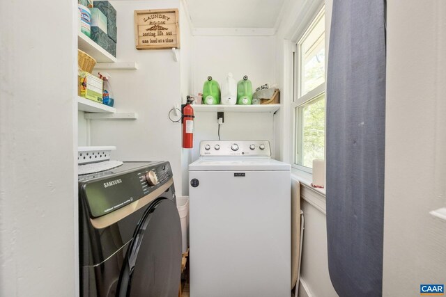 laundry area with washing machine and dryer