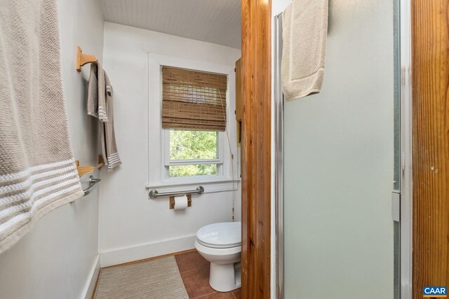 bathroom featuring tile patterned flooring and toilet