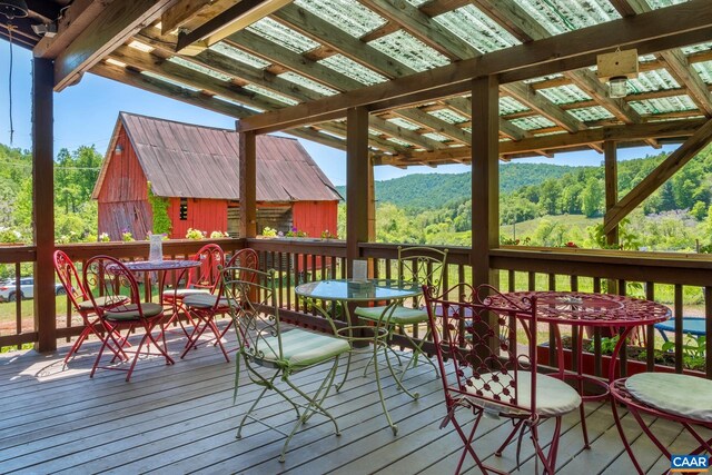 wooden deck with a mountain view