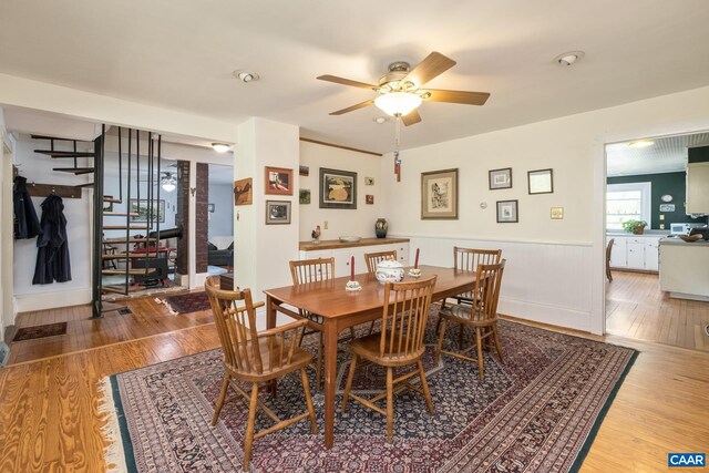 dining room featuring ceiling fan and wood-type flooring