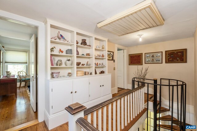 hallway with light hardwood / wood-style flooring