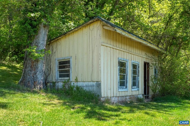 view of home's exterior with a lawn