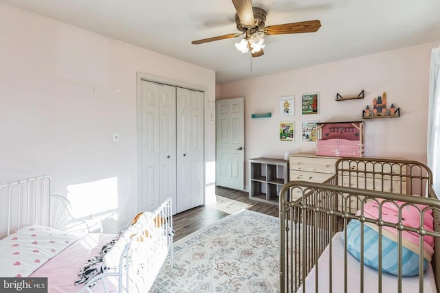 bedroom with ceiling fan, a closet, and wood finished floors