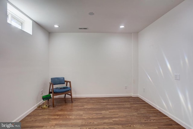 sitting room featuring recessed lighting, wood finished floors, visible vents, and baseboards