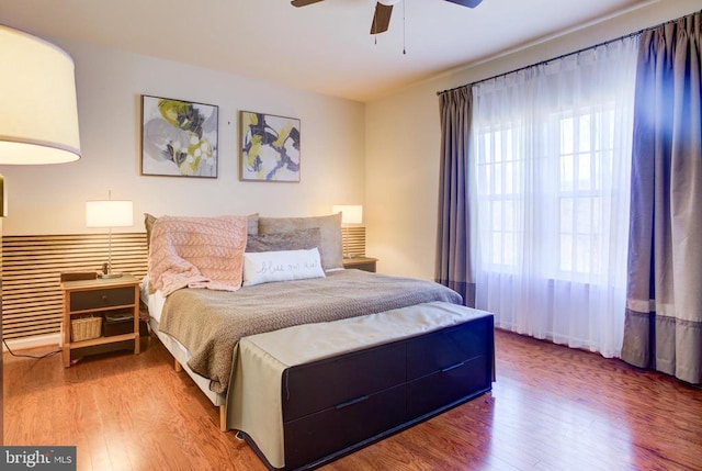 bedroom featuring a ceiling fan and wood finished floors