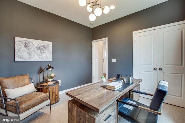 home office featuring light colored carpet, a notable chandelier, and baseboards