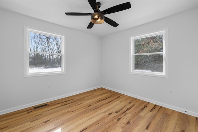 spare room featuring light hardwood / wood-style flooring