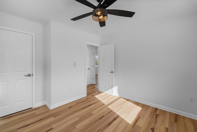 unfurnished bedroom featuring ceiling fan and light wood-type flooring