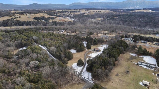 drone / aerial view with a water and mountain view