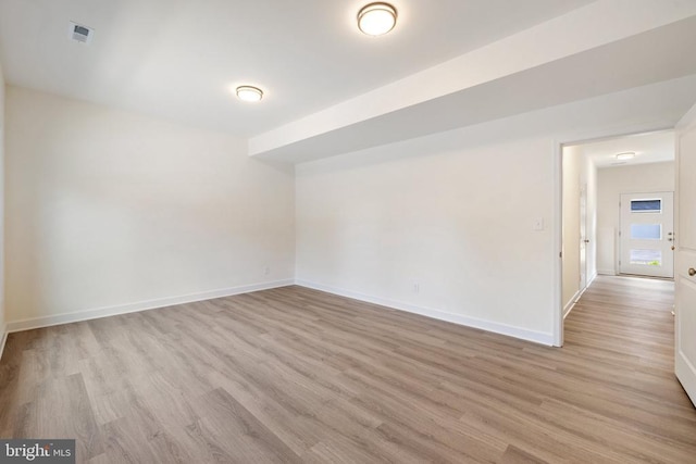 spare room featuring light wood-type flooring