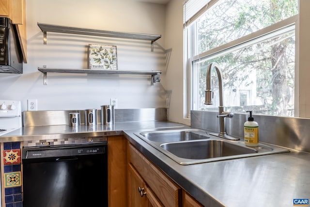 kitchen with brown cabinetry, black appliances, stainless steel countertops, and a sink