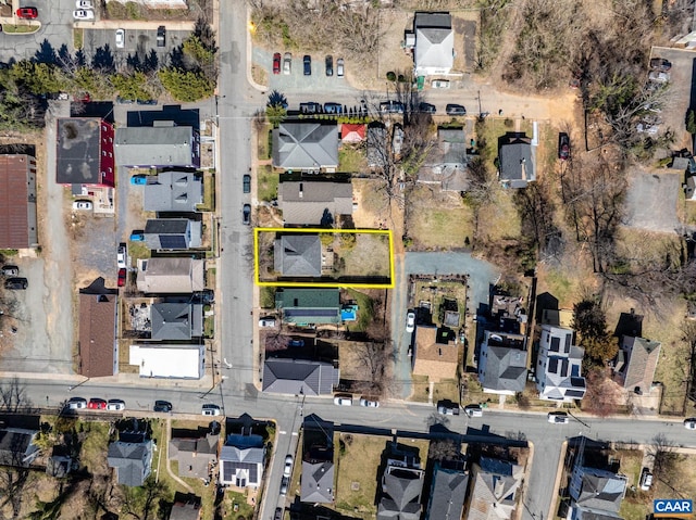 birds eye view of property with a residential view