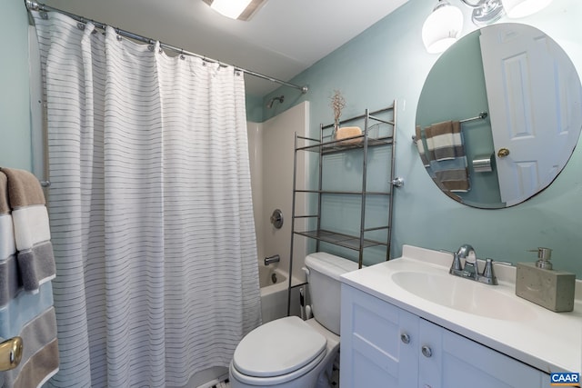 bathroom with vanity, shower / tub combo, and toilet