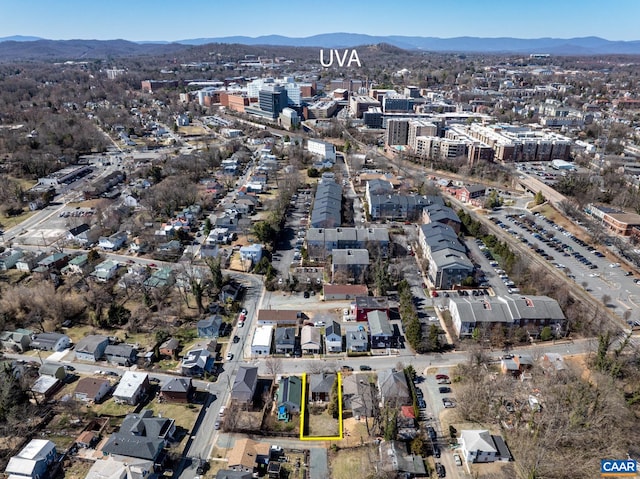 birds eye view of property with a mountain view