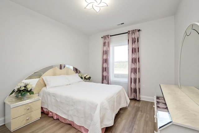 bedroom featuring light wood-type flooring