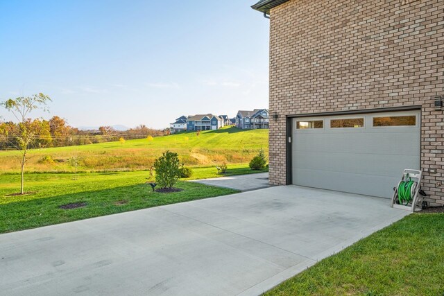 garage featuring a yard