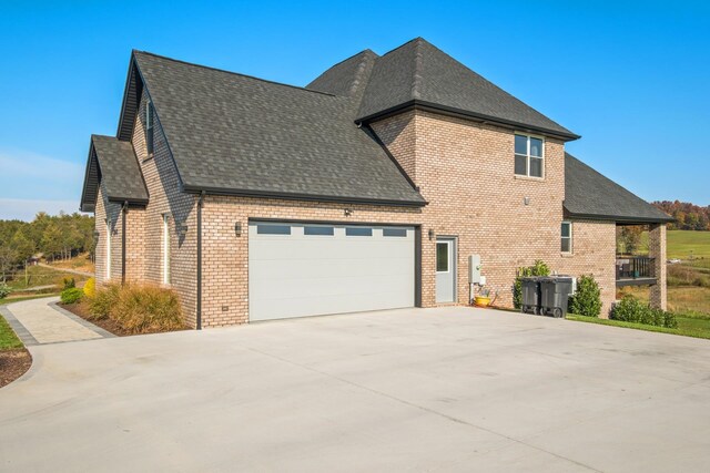 view of side of home with a garage