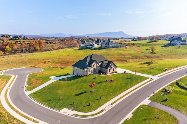 birds eye view of property featuring a mountain view and a rural view