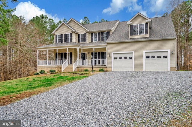 view of front of home with an attached garage, driveway, a porch, and a shingled roof