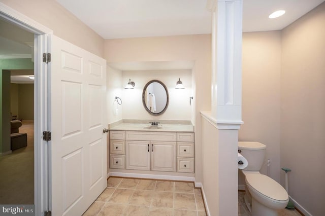 bathroom with vanity and toilet