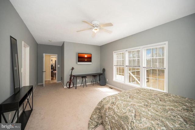 bedroom featuring ceiling fan, baseboards, and carpet flooring