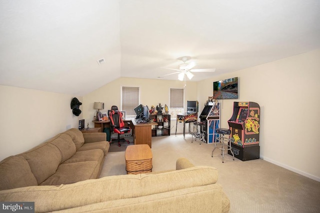 carpeted living room with vaulted ceiling, a ceiling fan, and baseboards