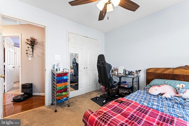 carpeted bedroom featuring a closet and ceiling fan