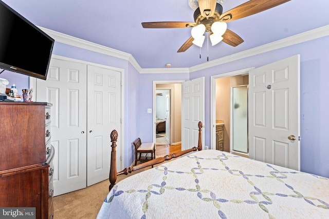 bedroom featuring ornamental molding, light colored carpet, ceiling fan, and a closet