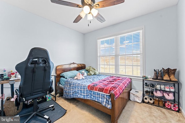 carpeted bedroom with ceiling fan