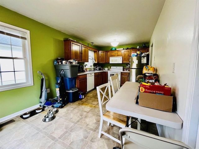 kitchen featuring sink and white appliances