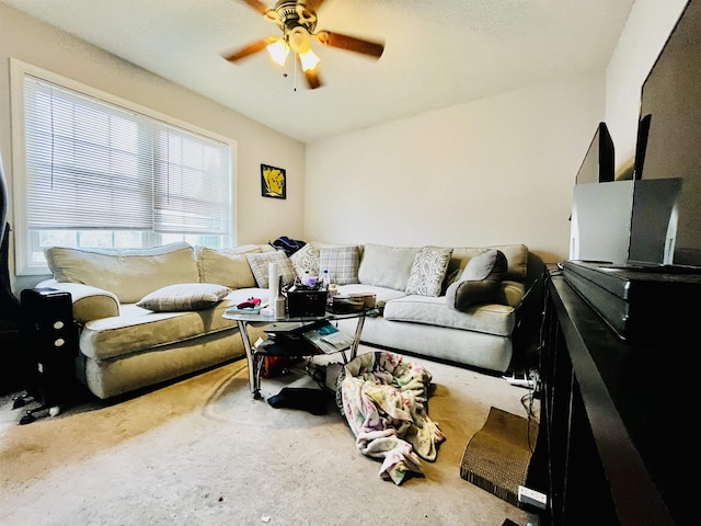 carpeted living room featuring ceiling fan