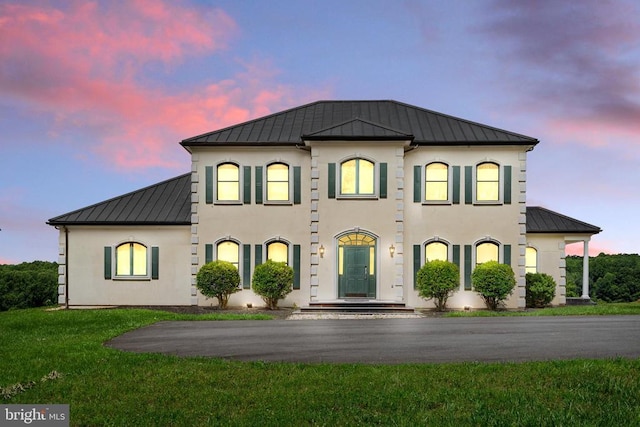 view of front of home with a lawn