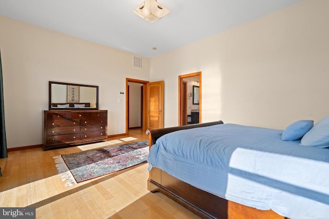 bedroom with light hardwood / wood-style flooring