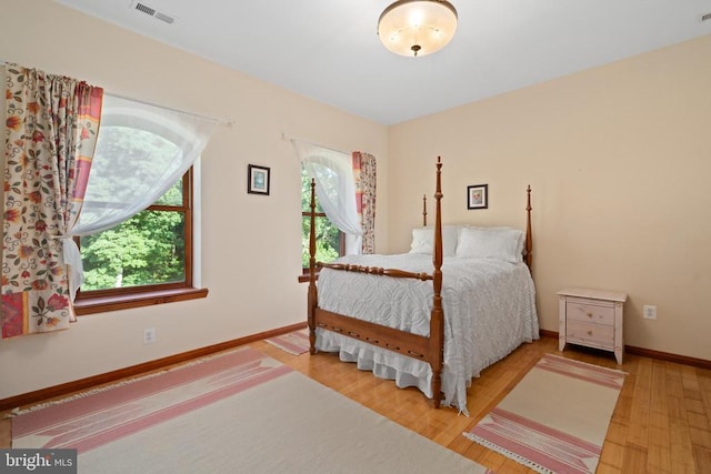 bedroom with hardwood / wood-style floors