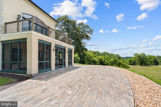 view of patio / terrace with a balcony