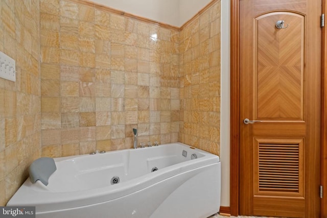 bathroom with tile walls and a tub to relax in