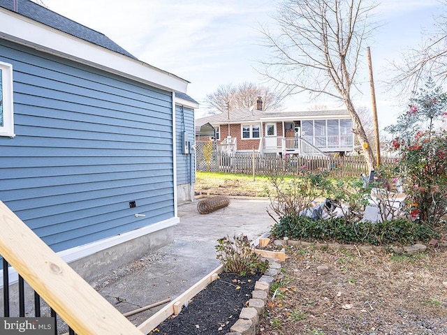 view of yard with a sunroom