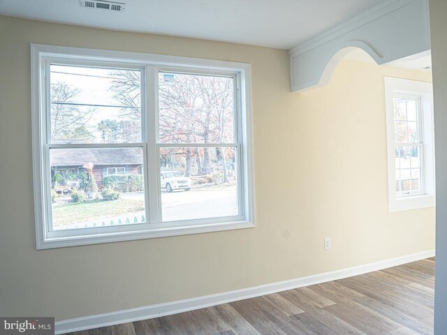 empty room with wood-type flooring