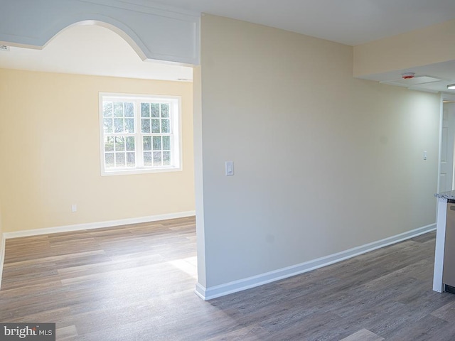 empty room with wood-type flooring