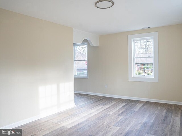 unfurnished room with light hardwood / wood-style flooring