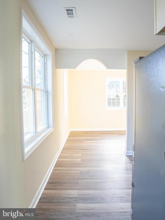 hall with light hardwood / wood-style floors