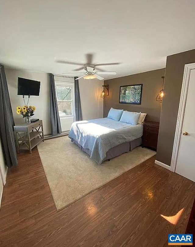 bedroom featuring ceiling fan and dark wood finished floors