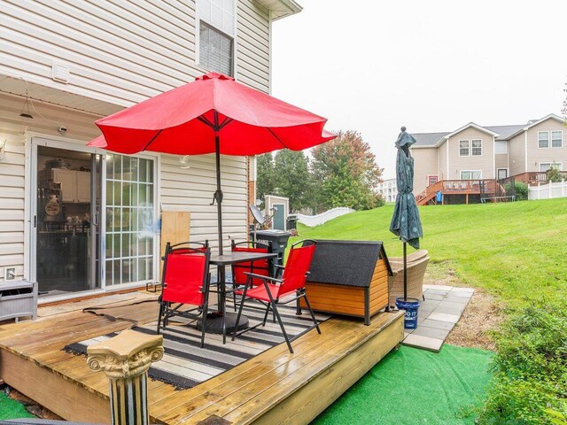 wooden deck with a yard