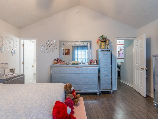 bedroom featuring dark hardwood / wood-style flooring and vaulted ceiling